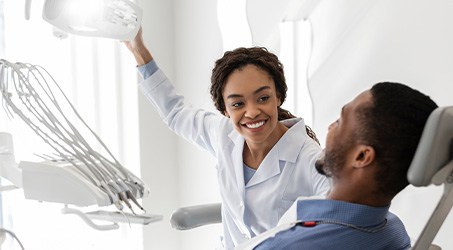 Patient in Springdale talking to dentist about wisdom tooth extraction