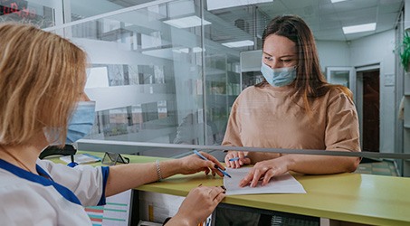 Patient in Springdale filling out paperwork for wisdom tooth extractions
