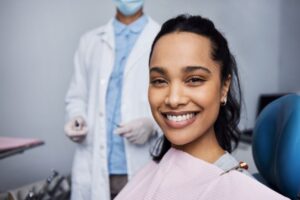 Smiling dental patient with dark hair and beautiful teeth